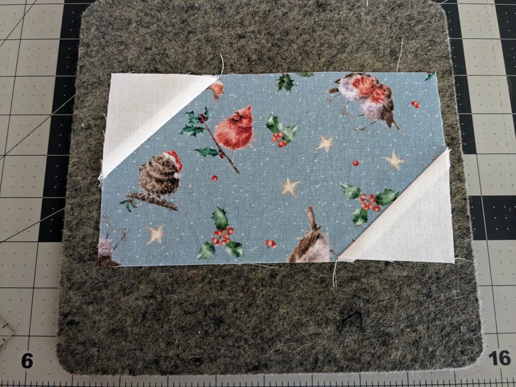 Piece B with both corners sewn on with piece A.