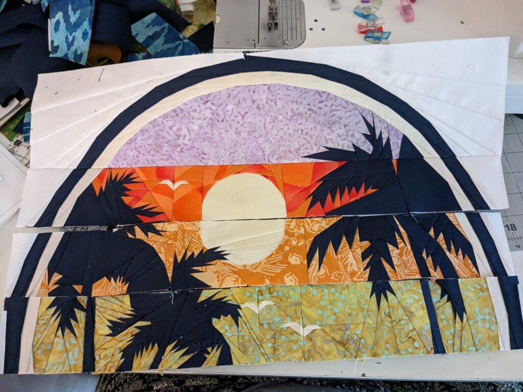 The first two rows sewn together with the 3rd and 4th row placed beneath it.