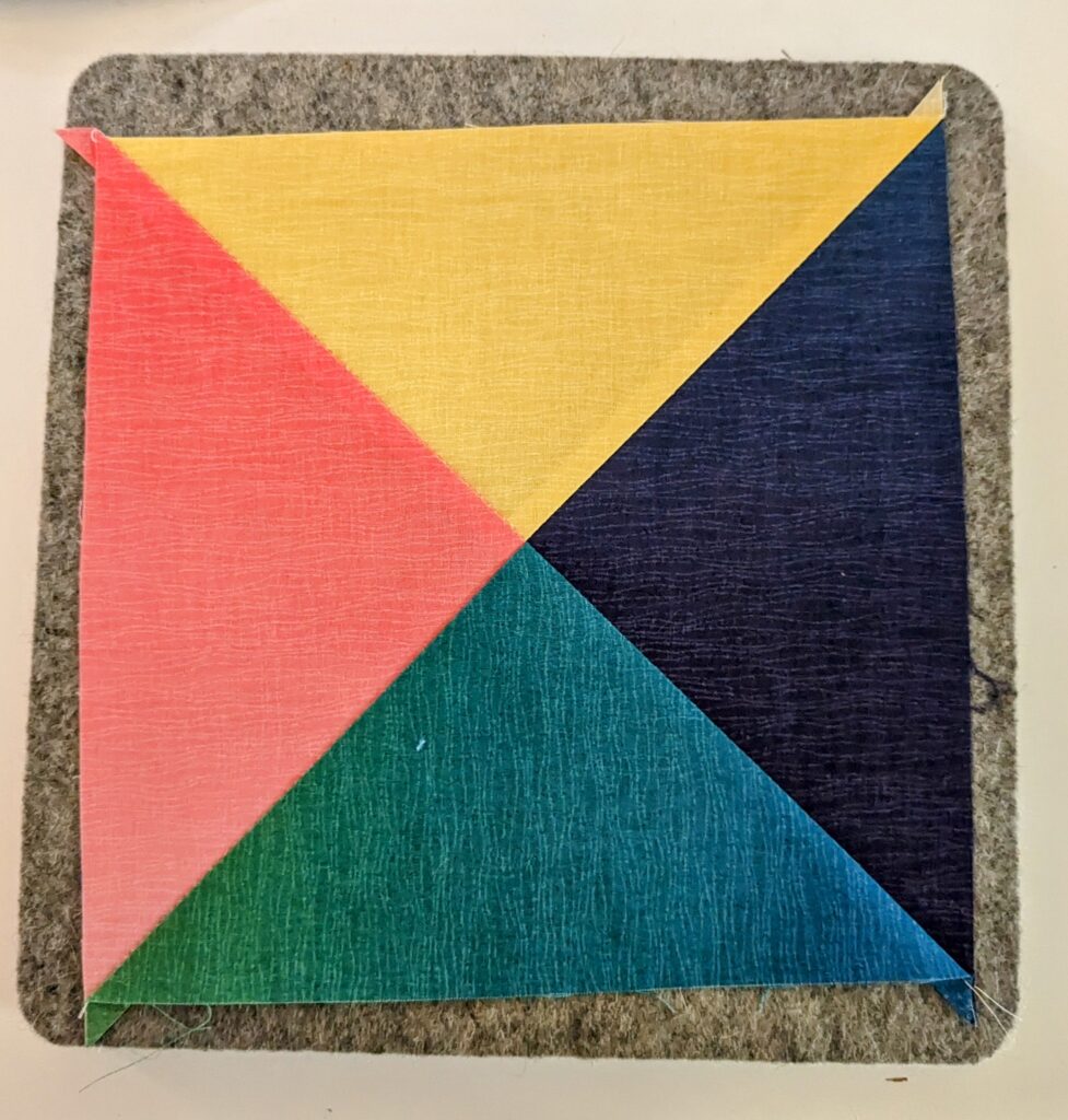 Quarter Square Triangle block prior to trimming.