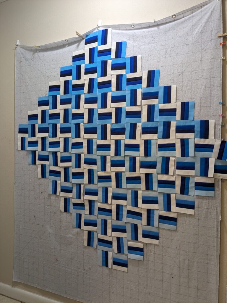 All the rail fence squares laid out on the design wall at an angle.