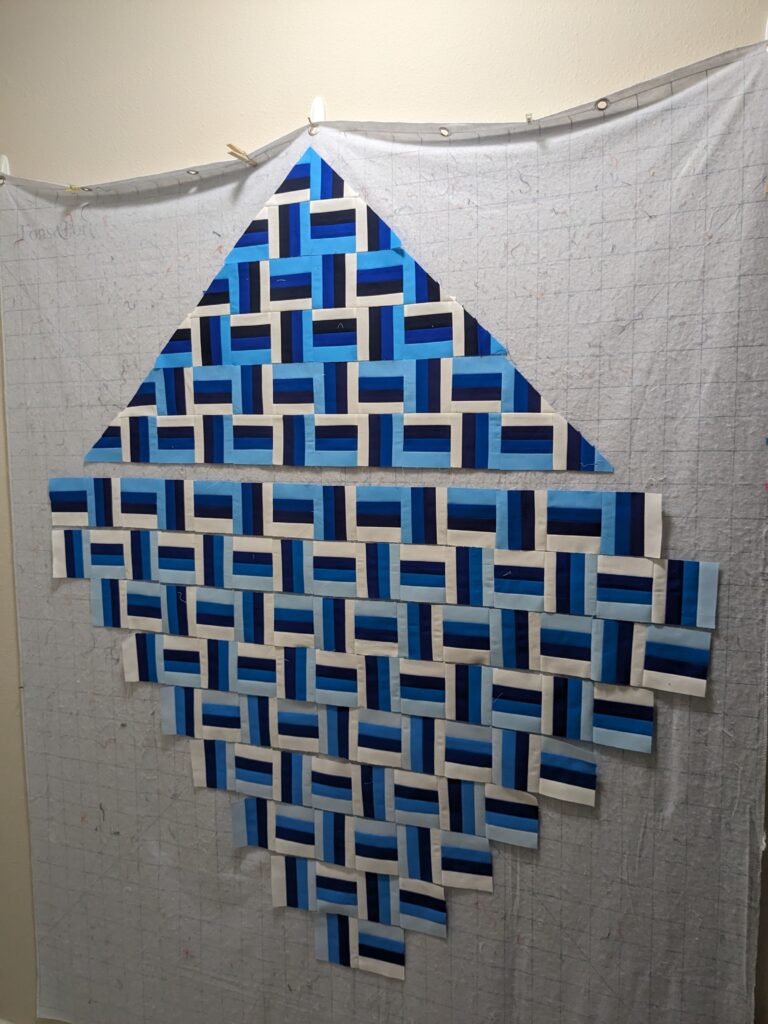 The partially sewn quilt on my design wall.