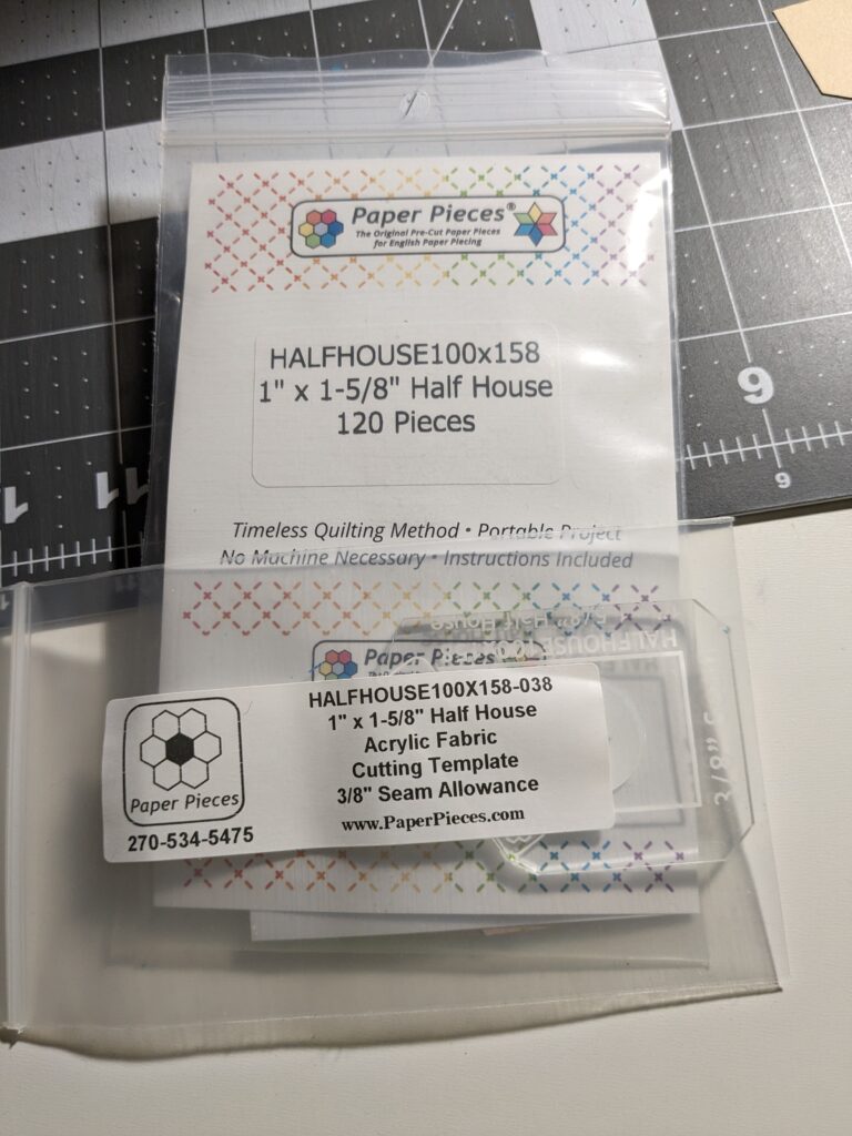 Half house english paper pieces and the acrylic cutting template for the half houses.