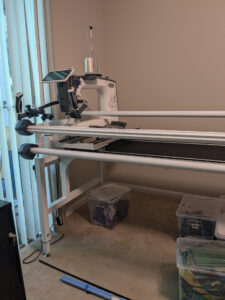 A photo of the left side of the frame. It is all put together and has my 19x Elite longarm machine on it.
