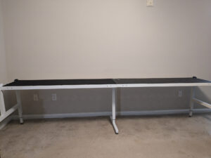 The first part of the frame is put together, sitting in front of the wall.