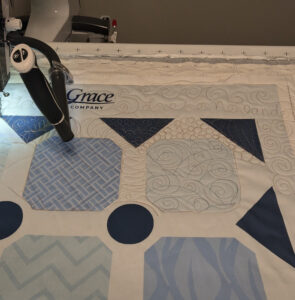 The practice panel that came with the frame. The photo shows the practice panel on the frame with some quilting already on it.